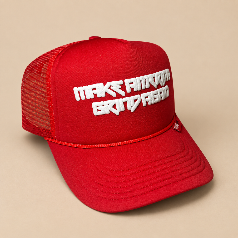 Red Make America Grind Again Collector’s Edition trucker hat on Grind Tan background